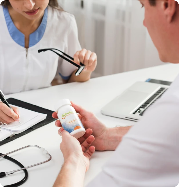 Doctor and patient at a consultation desk with a bottle of NerveReverse